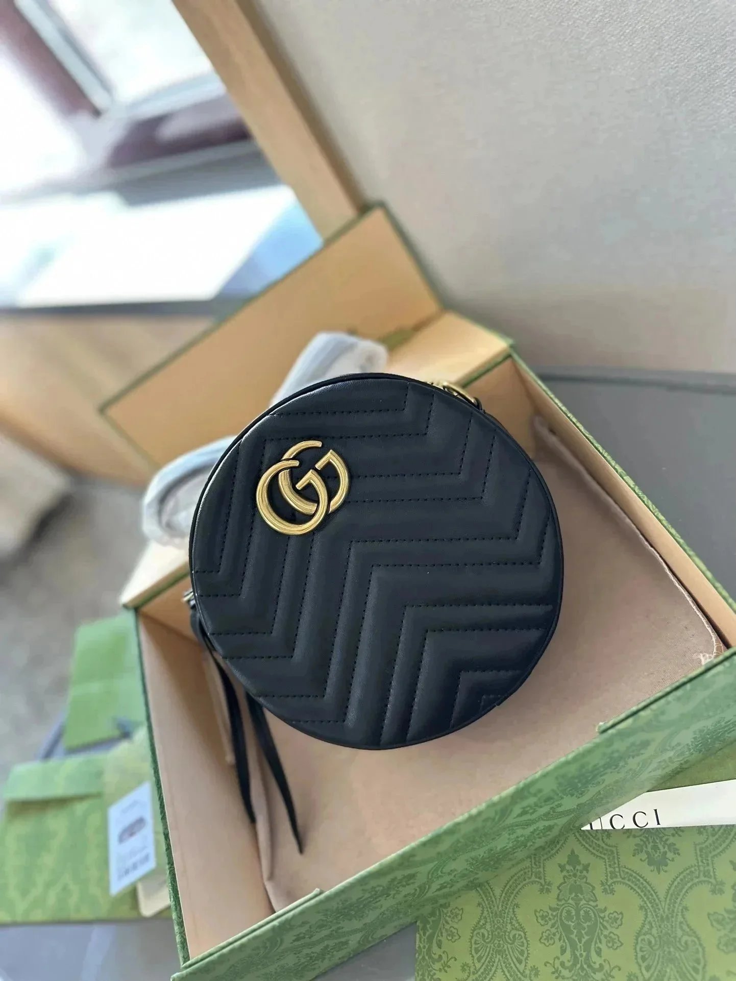 Gucci GG Marmont Round Shoulder Bag Mini Black in Matelasse Leather with Antique Gold-tone